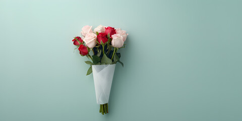Obraz premium bouquet of beautiful pink roses wrapped in craft paper