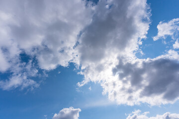Fluffy clouds and a blue sky