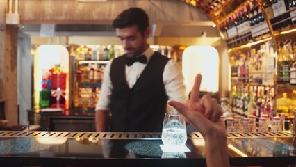 Serving special drink gin fizz of mixed cocktail to smiling VIP customer with couple or friend group by smart bartender service at beverage counter bar luxury nightlife at nightclub party. Vinosity.