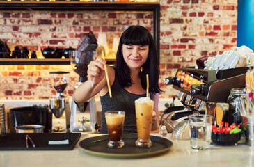 Woman, service industry and iced coffee at counter for customer order, luxury and waitress in cafe....