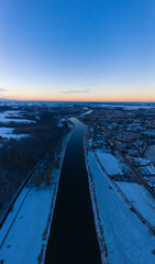 Landscape on the Elbe River in winter at blue hour