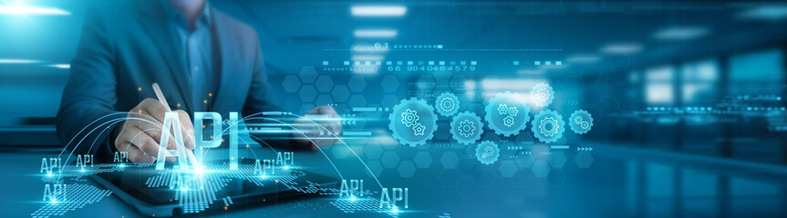 Application Programming Interface. Businessman analyzing API data and growth graph on office table...