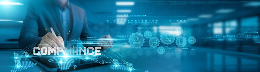 Compliance. Businessman analyzing compliance reports and regulatory compliance graph data on office...