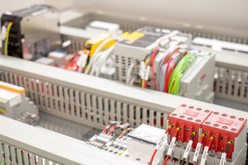 Industrial control panel with multicolored wiring.