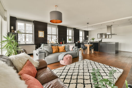 Stylish modern living room with open kitchen design