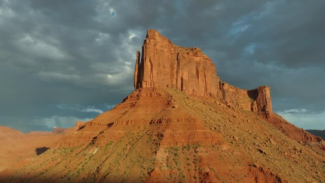 Aerial imagery above Moab desert scene with rocky outcrops and Mesa in 4K
