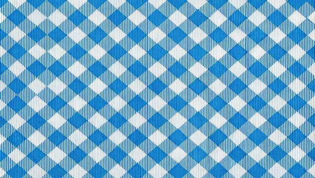 Traditional Bavarian checkered pattern, Schottenmuster, on a bright blue and white fabric, often used for aprons, tablecloths, and rustic home decor accessories.