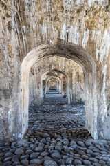 tunnel of archs in an old building