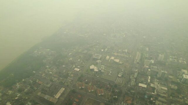 Smoke Blanket: Aerial View of Amazon Wildfire Impact on Nearby City