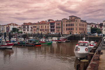 Fototapeta premium Town of Saint Jean de Luz in the Basque country in France, with boats in the port