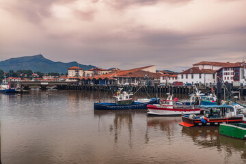 Fototapeta premium Town of Saint Jean de Luz in the Basque country in France, with boats in the port