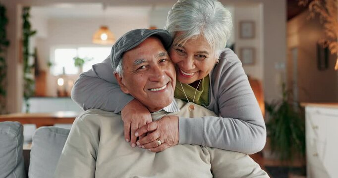 Senior couple, face and kiss in home for support, commitment and love for comfort in lounge. Elderly people, couch embrace and romance in retirement portrait, Mexico and bonding for trust in marriage