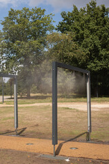 Path in the park with dispersion of water