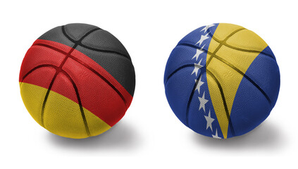 basketball balls with the national flags of bosnia and herzegovina and germany on the white background.