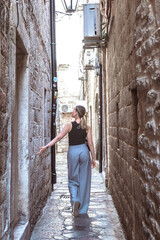 Travel. Woman walking through old town and sightseeing, eco travel, solo female travel, digital nomad, vacation, business travel, nomad aesthetic,travel old town