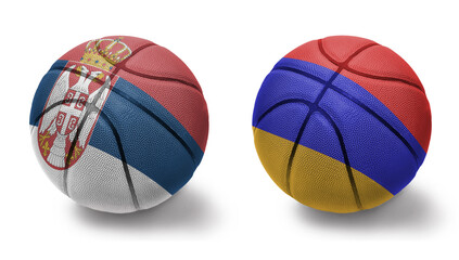 basketball balls with the national flags of armenia and serbia on the white background.