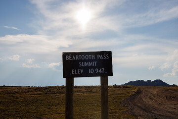 Beartooth Pass sign on scenic Beartooth Highway 212 in Wyoming during summer.