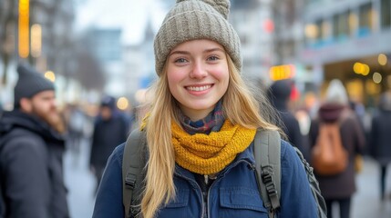 A cheerful girl in a cozy yellow scarf and beanie stands in a bustling city street filled with people, capturing the lively atmosphere of winter