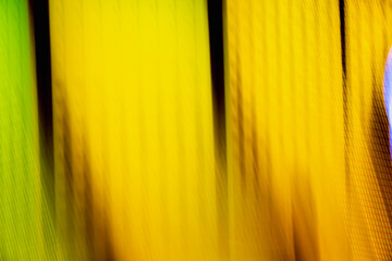 A blurry image of a yellow background with a green stripe