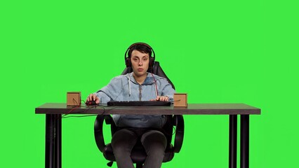 POV of player getting focused playing online video games on pc, using keyboard as controls and has fun with free time. Woman gamer participating in shooter contest on computer. Camera B.