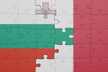 puzzle with the colourful national flag of malta and flag of bulgaria.