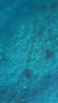 Phuket Thailand Fiji tropical beach Aerial drone top down view bird eye view of sea azure waves pattern. Beautiful of sea water wave come to beach. Sky blue shallow water, paradise copy space concept