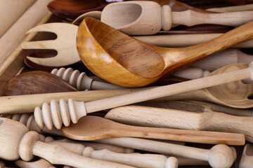Wooden spoon on a background of woodwork, close-up