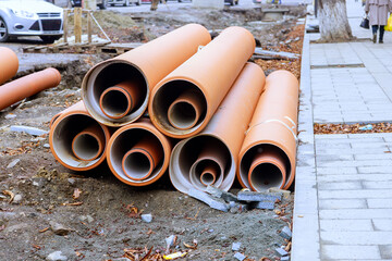 Pipes of HDPE polyethylene sewer waiting to be installed, ready to form backbone of new infrastructure