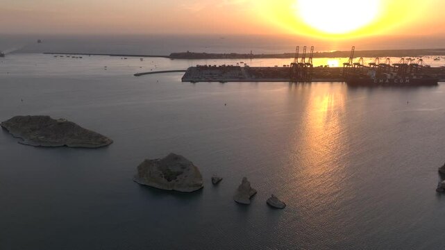 Huge Port of Karachi at sunset time. Cargo Ship Docked at KPT Karachi, Aerial Drone Shot