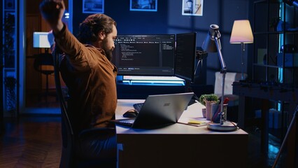 Fatigued developer working overnight at home, rubbing eyes while taking break from coding, feeling...