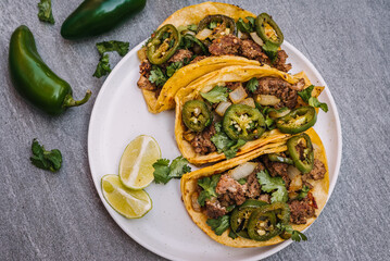 Tacos with grilled jalapeño and onion