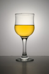 Glass of apple juice isolated on a white background.