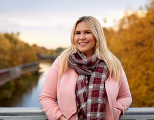 Fototapeta premium Happy Woman's Autumn Portrait: Outdoor Headshot with Smiling Expression and Copyspace