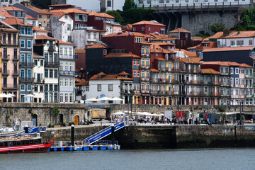 View of Porto city and Douro river and Dom Luis bridge. Porto, Vila Nova de Gaia, Portugal. Cityscape along the river