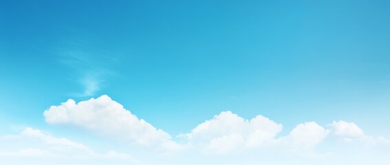 Fototapeta premium Panoramic View of a Clear Blue Sky with Clouds and White Space at the Bottom, High-Resolution, Minimalistic Design