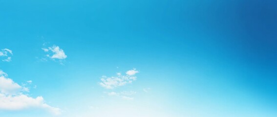 Fototapeta premium Panoramic View of a Clear Blue Sky with Clouds and White Space at the Bottom, High-Resolution, Minimalistic Design