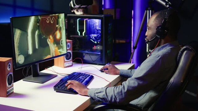 Man using headset to play SF FPS videogame, having fun in dark apartment room. Gamer competing in PvP online multiplayer game, shooting other players with futuristic gun, camera B close up