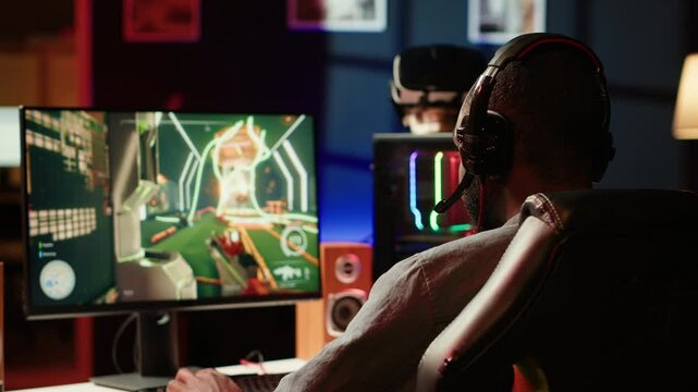 Man face palming in front of computer display while playing videogames on gaming PC, receiving game over. Gamer feeling upset after being defeated by rival players in esports tournament, camera A