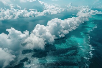 Naklejka premium Bird s eye view of the ocean obscured by fluffy white clouds