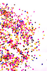 flying gold red colorful confetti isolated on white background 