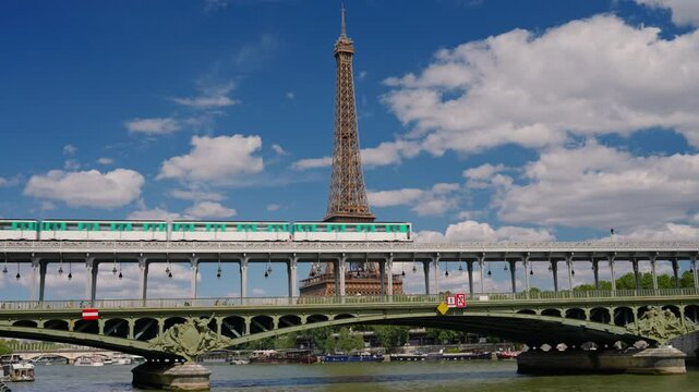 Establishing shot of Paris, France. Landmark iron tower in background. View of the Eiffel Tower from one of the streets of Paris. Parisian architecture of houses in the center of the capital