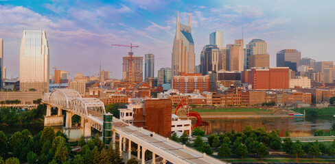 John Seigenthaler Pedestrian Bridge crossing the Cumberland River and downtown Nashville,...
