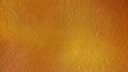 Detailed close-up of orange textured surface resembling reptile skin.