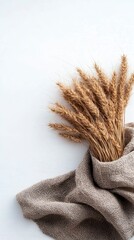 Wheat Sheaves and Burlap Fabric on a White Background