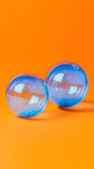 Fototapeta premium Blue Soap Bubbles on Orange Background, Abstract Image, Texture, Pattern, Wallpaper, Cover and Screen for Smartphone, PC, Laptop, 9:16 and 16:9 Format