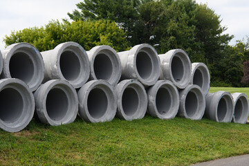 concrete round big pipes stacked outdoors sewer large heavy water materials new