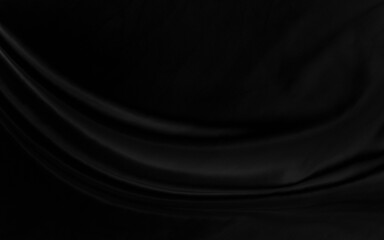 Black gray satin dark fabric texture luxurious shiny that is abstract silk cloth background with patterns soft waves blur beautiful.