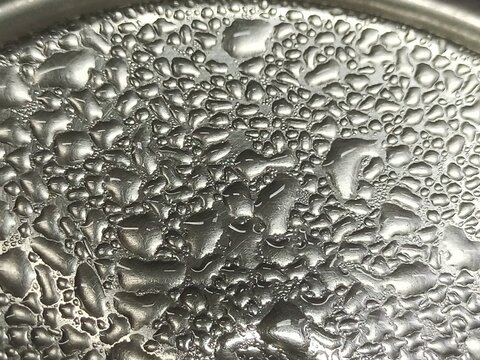 Close Up. Water Dew on stainless.