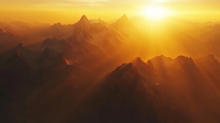Naklejka premium Golden Hour Majesty: Aerial Sunrise Over Majestic Mountain Range