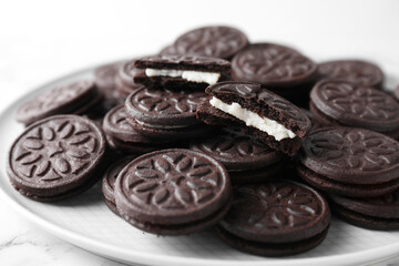 Tasty sandwich cookies on white marble table, closeup